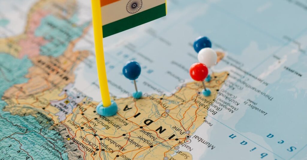 pexels-photo-8828354-8828354-1 Indian map close-up with a flag and multiple colored pushpins.